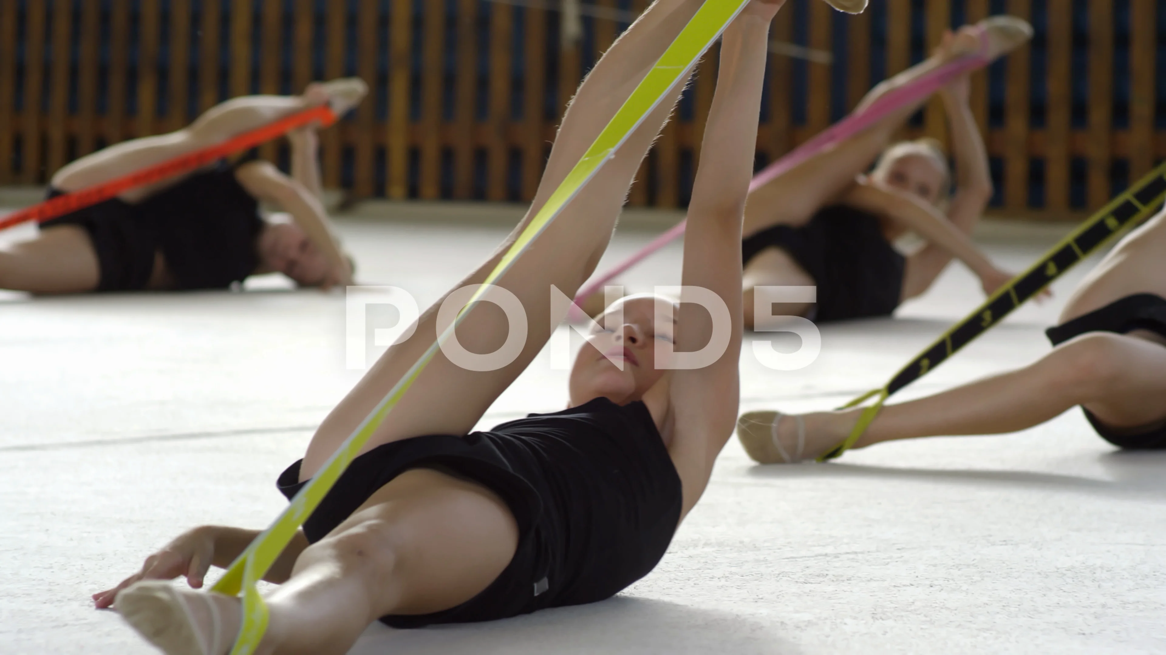 Girls Stretching Legs in Gymnastics Clas, Stock Video