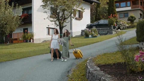 Girls with suitcases using paper map Video stock 119577869