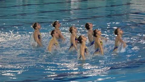 Girls synchronized swimmers Stock Footage