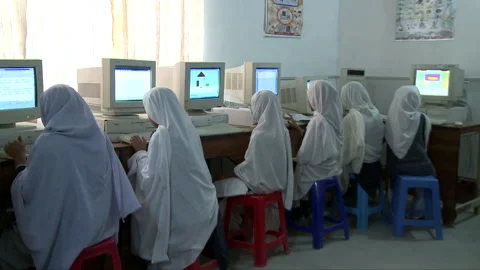 Girls taking computer classes in rural area Stock Footage 202216783