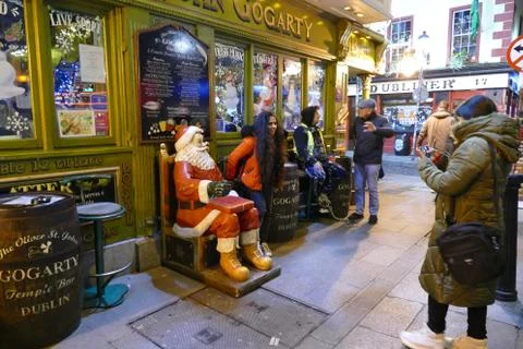 Girls taking pictures out side of a bar, Christmas season,16th,December,Dublin. Stock Photos