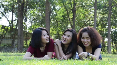 Girls talking in park Stock Footage 58583239