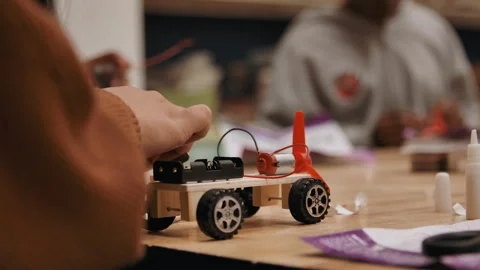 Girls in trades building engineering project of cars Stock Footage 283489534
