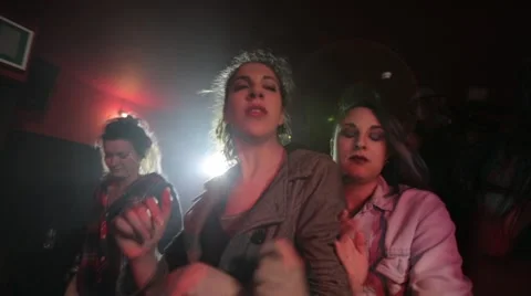 Girls trying to get in front while dancing in night club Stock-Footage 50659898