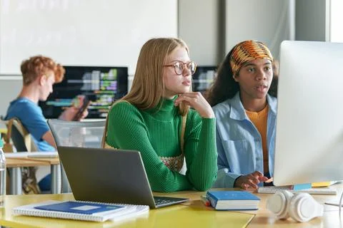 Girls using Computers IT Class Stock Photos