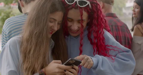 Girls using smartphone. Visual content photos and videos memory preservation. Stock Footage 250023866