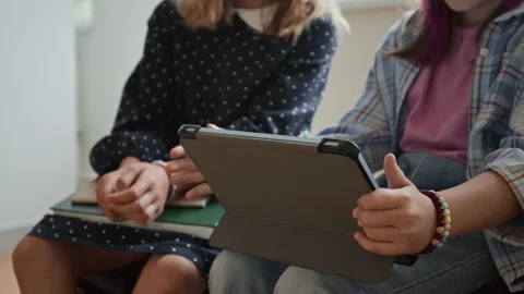 Girls Using Tablet Computer for Digital Learning in Classroom Stock Footage 345217197