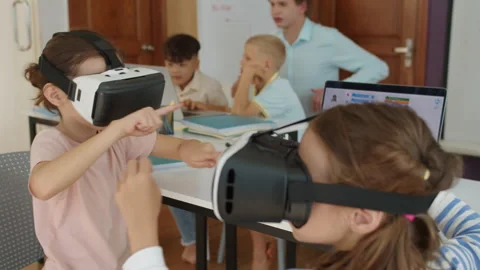 Girls Using VR Glasses during Group Computer Class at School Stock Footage 280537462