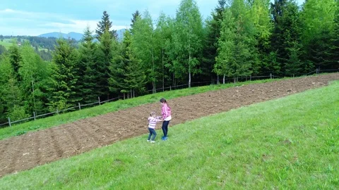 Girls walking at meadow Stock Footage