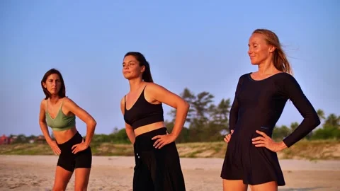 Girls warming up on the beach Stock Footage 265840522