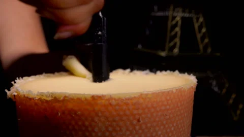 Girolle cheese scraper knife cuts shavings from a top of hard parmesan cheese Stock Footage 136480786