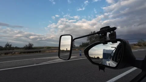 Girona, Spain; August 22 2026: Car towing a caravan on highway in Girona, Spa Stock Footage 344146168