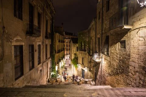 Girona street view with cafe in old town in the night Stock Photos