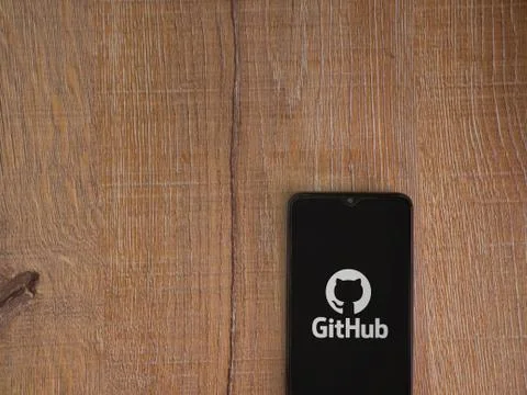 GitHub app launch screen with logo on the display of a black mobile smartphon Stock Photos