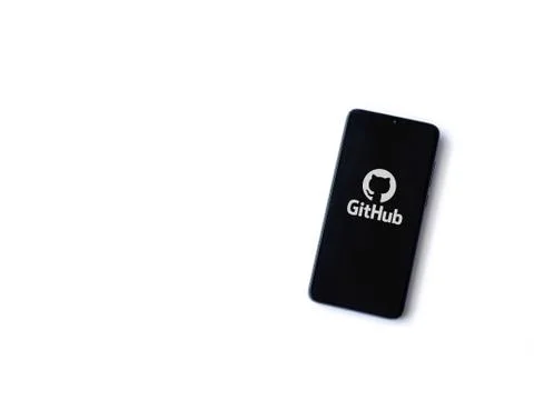 GitHub app launch screen with logo on the display of a black mobile smartphon Stock Photos