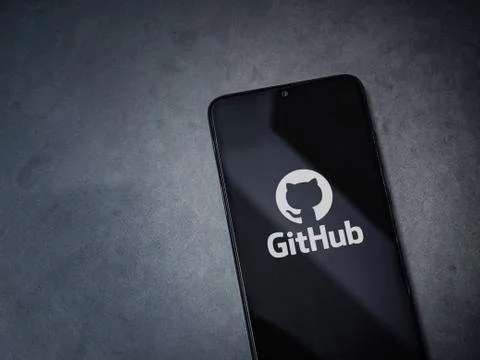 GitHub app launch screen with logo on the display of a black mobile smartphon Stock Photos