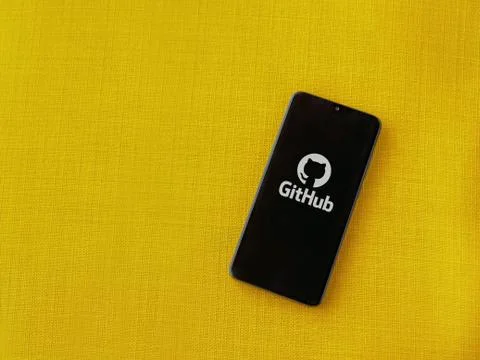 GitHub app launch screen with logo on the display of a black mobile smartphon Stock Photos