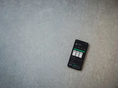 GitHub app play store page on the display of a black mobile smartphone on cer Foto stock