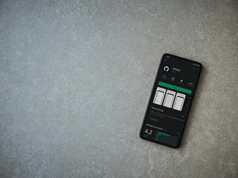 GitHub app play store page on the display of a black mobile smartphone on cer Foto stock