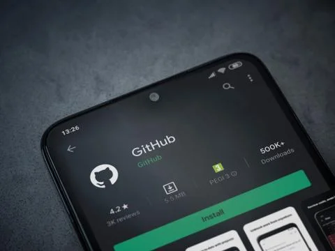 GitHub app play store page on the display of a black mobile smartphone on dar Foto stock
