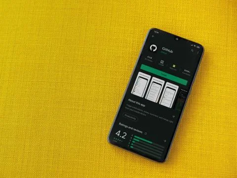 GitHub app play store page on the display of a black mobile smartphone on a y Foto stock