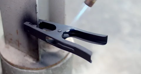 Give heat to the workpiece.Remove moisture from the workpiece with heat. Stock Footage 311091139
