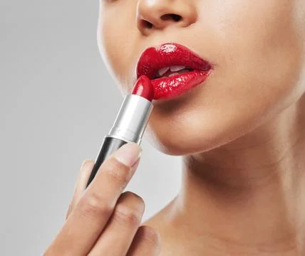 Give her red and shell rule the world. Studio shot of an unrecognisable woman Stock Photos