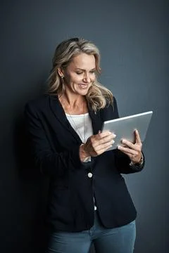 Give your work performance a boost. Studio shot of a mature businesswoman using Foto stock