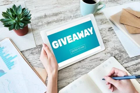 Giveaway, enter to win text on screen. Lottery and prizes. Social media Stock-Fotos