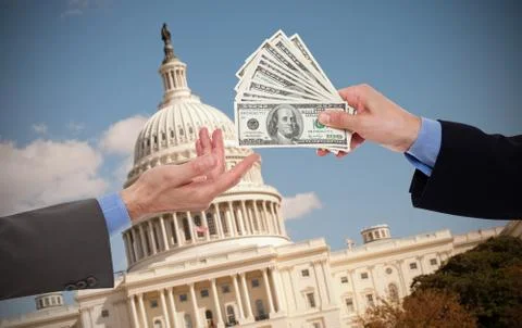 Giving a bribe, hands of businessmen or politicians Stock Photos