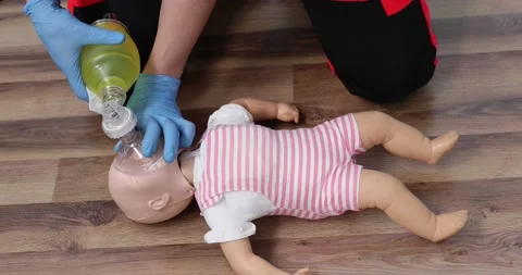 Giving first aid on a child Stock Video Pond5