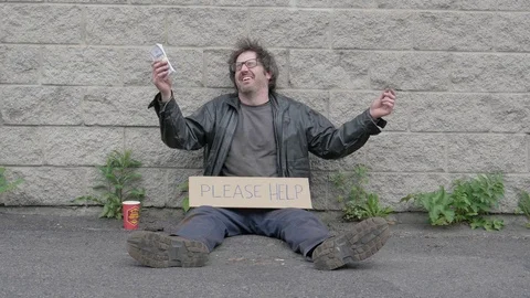 Giving A Large Stack Of Money To A Homeless Man Stock Footage 75963919