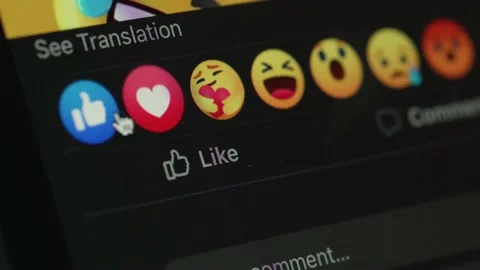 Giving a Like Thumbs Up on a Facebook Post Closeup on Screen Stock Footage 223263196