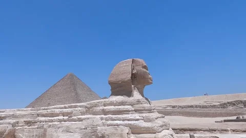 Giza, Egypt - The Great Sphinx and Pyramid - Aerial Pan Left Stock Footage 255924357