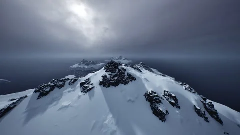 Glacial boundaries dissolve into restless oceans beneath looming storm clouds Stock Footage 331400317