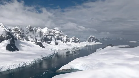 Glacial coastline and mountain range in Antarctica aerial view Stock Footage 337951656