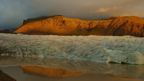 Glacial Lagoon and Mountain Reflection at Sunset in Iceland Stock Footage 320508699
