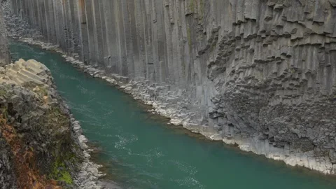 Glacial River Flowing Through Basalt Column Formations of Stuðlagil Canyon in 库存影片 339877361