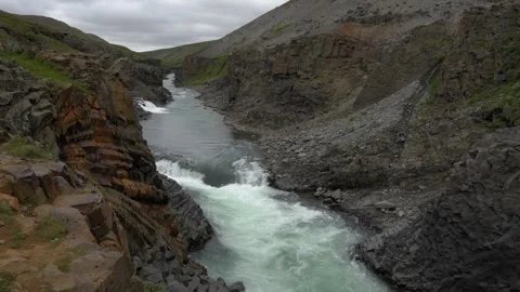 Glacial River Flowing Through Basalt Column Formations of Stuðlagil Canyon in 库存影片 339877362
