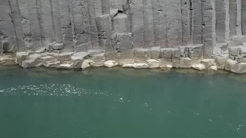 Glacial River Flowing Through Basalt Column Formations of Stuðlagil Canyon in Stockbeeldmateriaal 339877496
