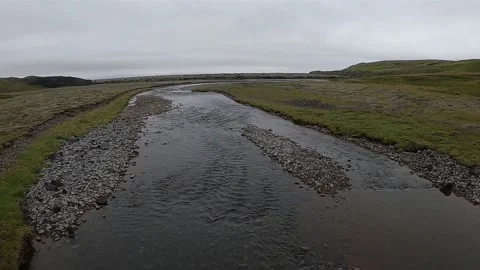 Glacial river flowing through mossy volcanic plains, Iceland Stock-Footage 334319496