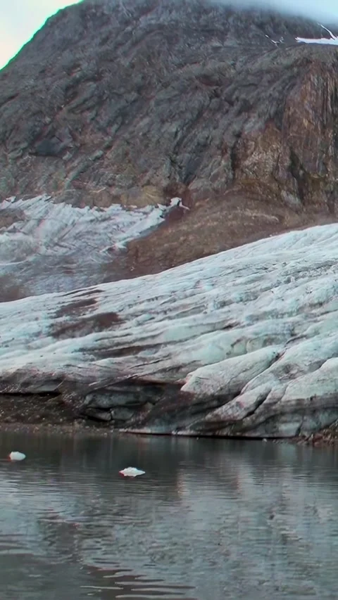 Glacial River Meets Mountain in Remote Svalbard Landscape Stock Footage 320326680
