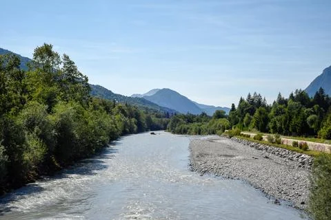 Glacial river winds through a dramatic mountain landscape Stock Photos