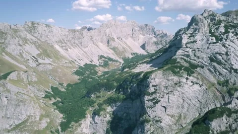Glacial Valley and Mountain Ridge in Sunny Montenegro Aerial Drone Footage Stock Footage 201149904