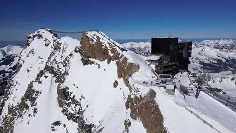 Glacier 3000 with cable car station and Peak Walk suspension bridge Stock Footage 303442880
