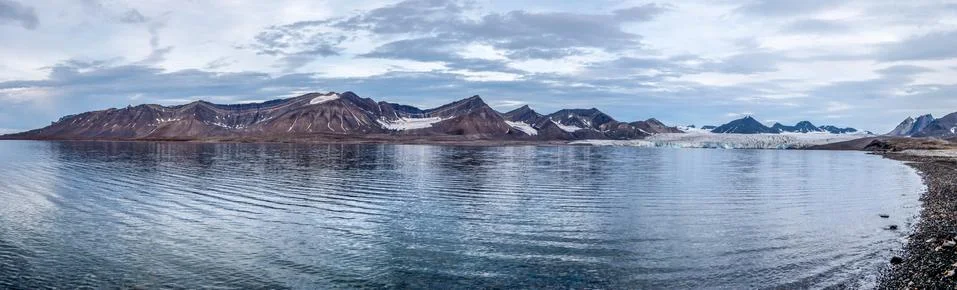 Glacier and mountain range reflections Stock Photos