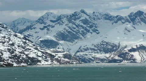Glacier Bay iceberg floating snow covered mountains Alaska HD 7265 Stock Footage 24746953