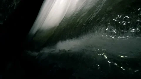 Glacier cave ice caving - track gas bubbles in freezing water Stock Footage 153320872