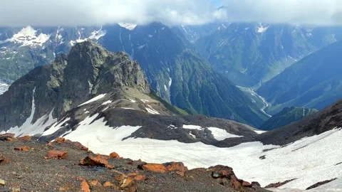 Glacier descending wide view between rugged peaks in Svaneti Stock Footage 343772563