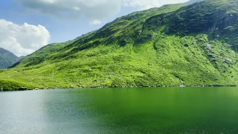 Glacier Express Train View over Alpine Lake Oberalp and Swiss Alps Stock Footage 286708993